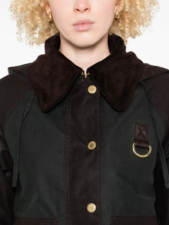 Close up of the green jacket, showing texture of the cotton fabric