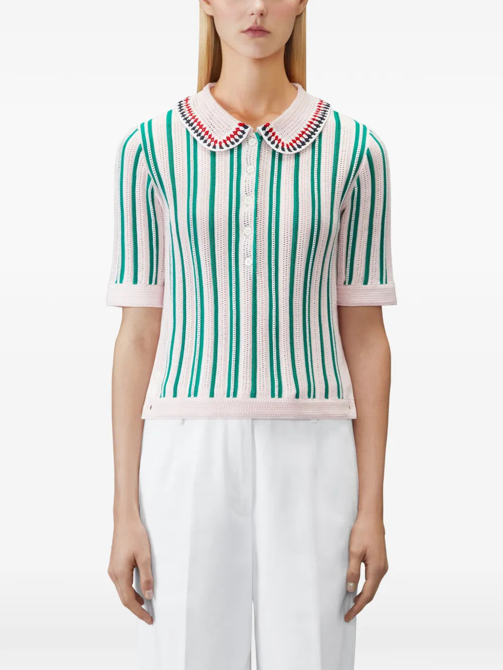 Pink shirt worn by a person, showing the shirt fit