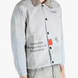 Grey jacket worn by a person, showing the jacket's fit