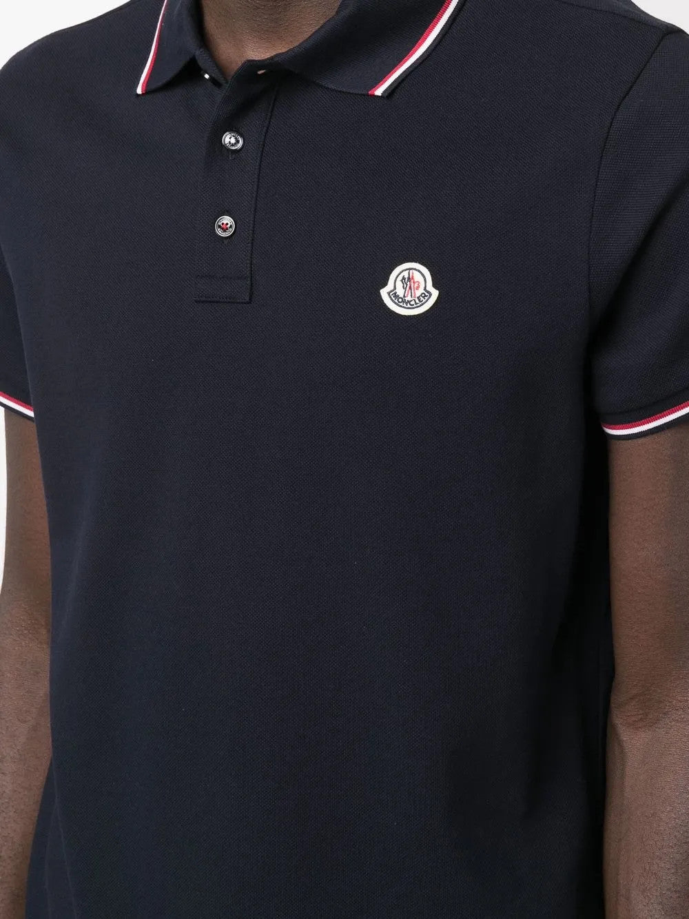 Navy t-shirt worn by a person, showing the t-shirt fit