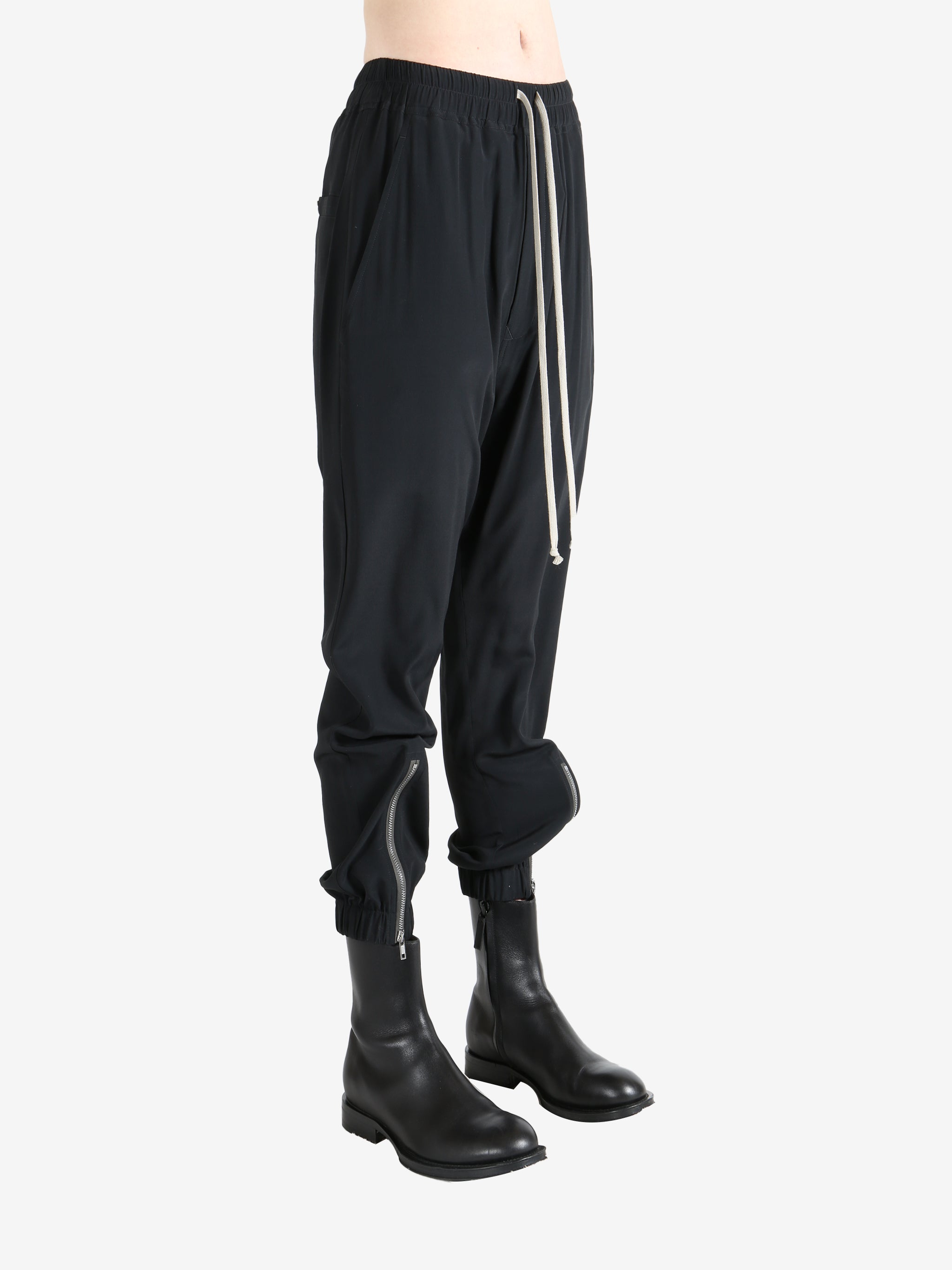 Black pant worn by a person, showing the pant's fit