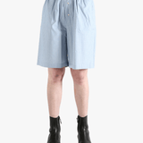 Blue shorts worn by a person, showing the shorts' fit