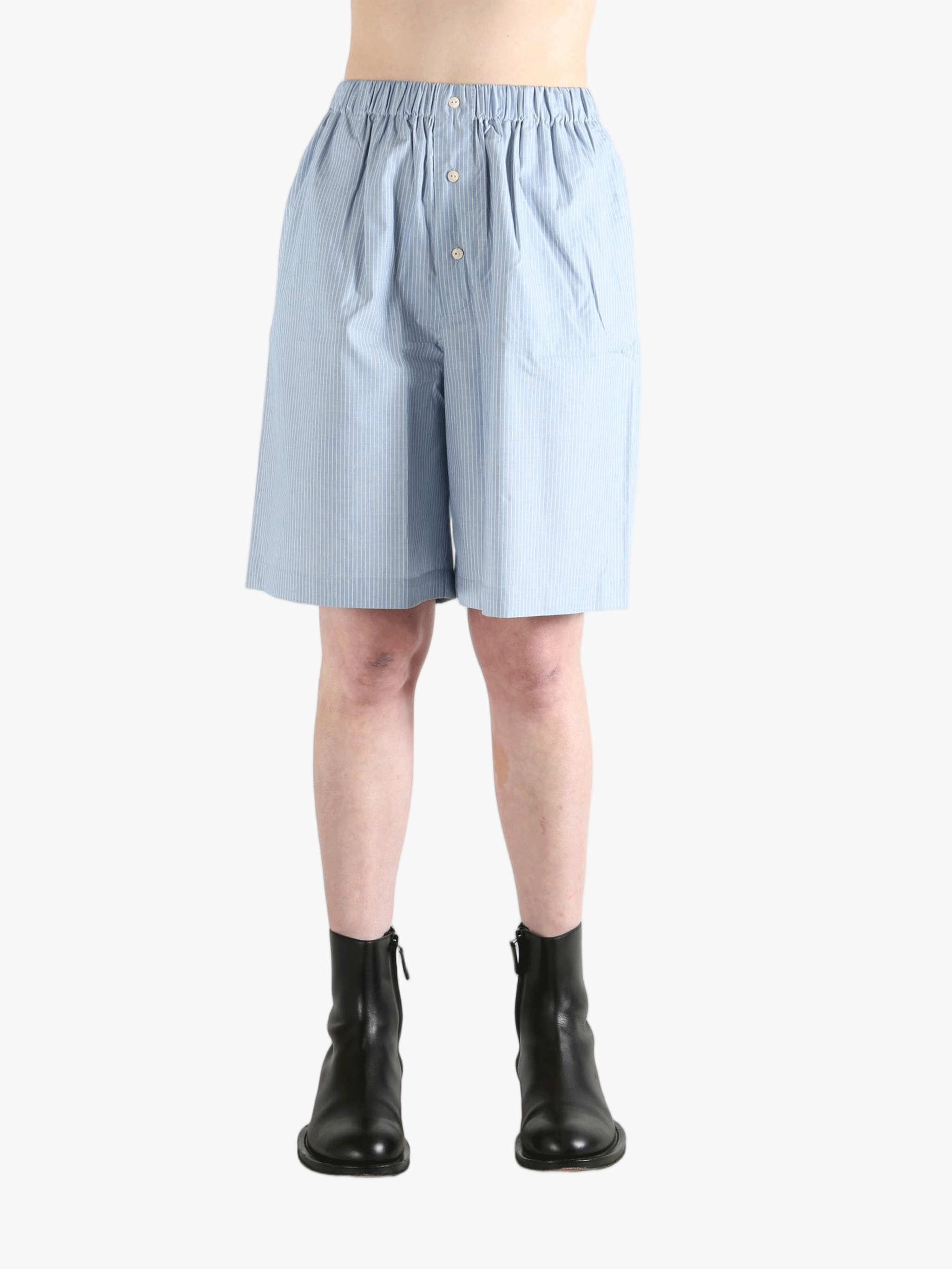 Blue shorts worn by a person, showing the shorts' fit