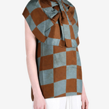 Brown top worn by a person, showing the top fit