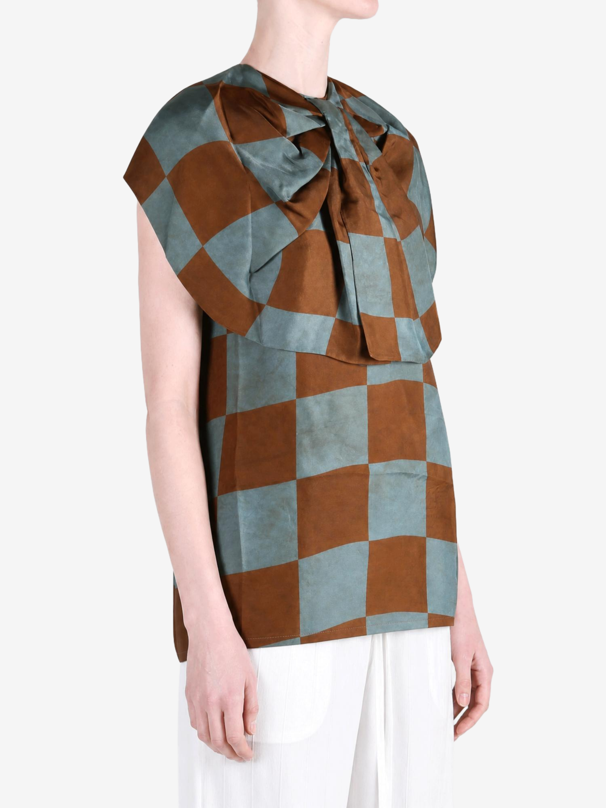 Brown top worn by a person, showing the top fit