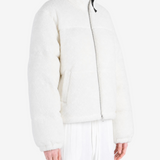 White jacket worn by a person, showing the jacket fit