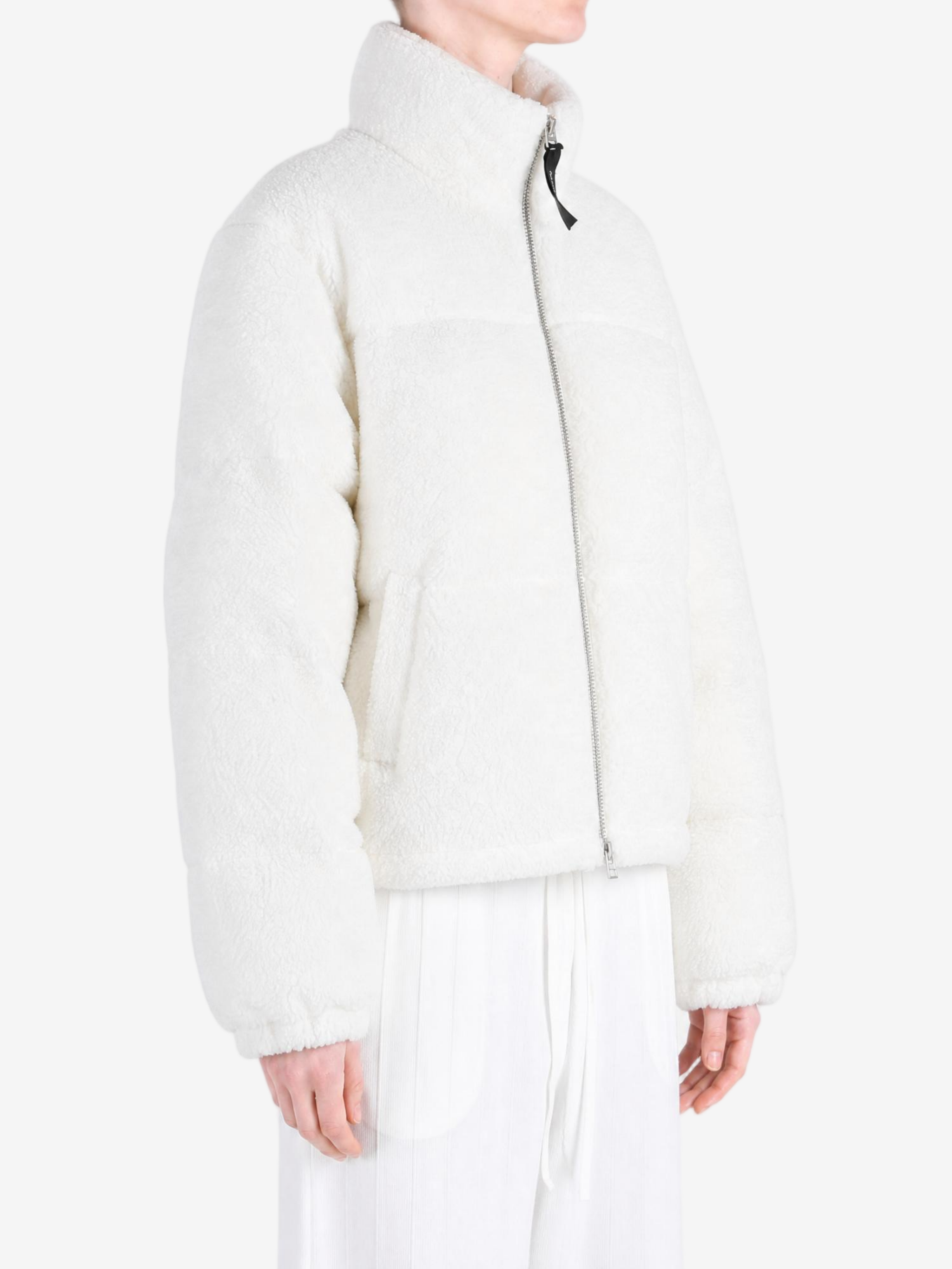 White jacket worn by a person, showing the jacket fit