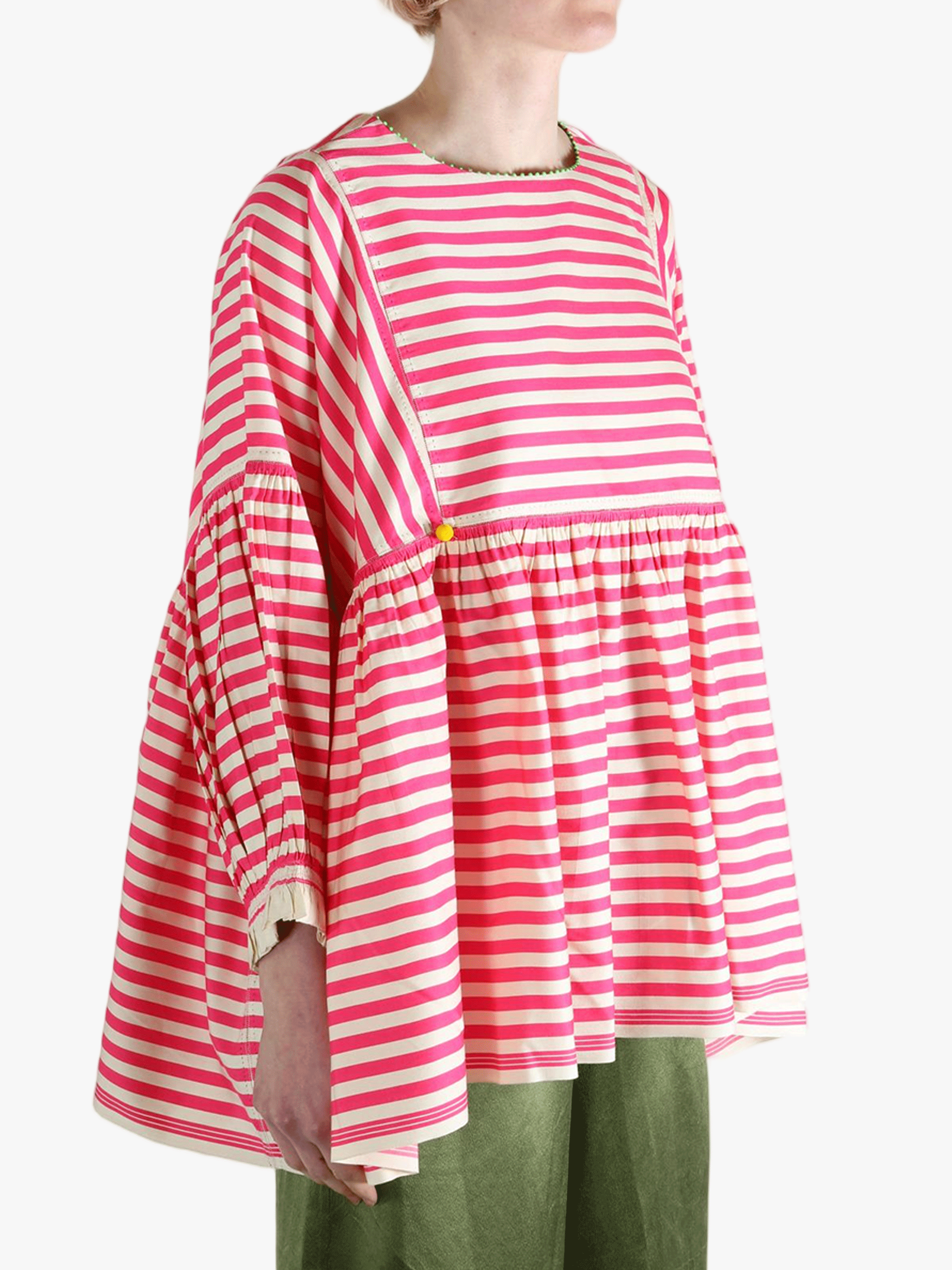 Red top worn by a person, showing the top's fit