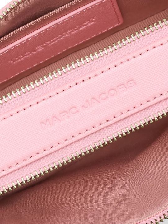 close up of pink bags, showing texture of the leather fabric