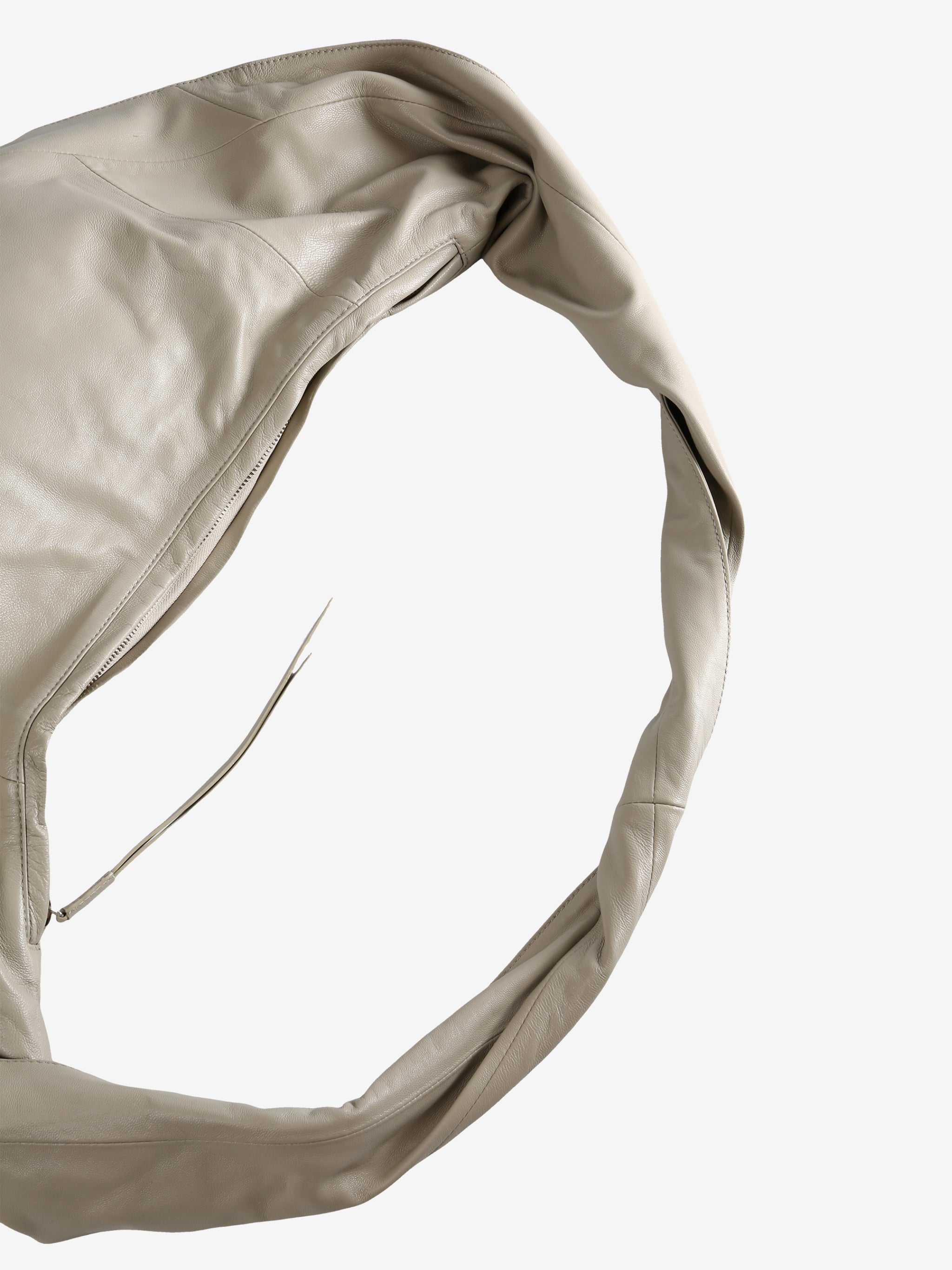 Close up of the tan bag, showing texture of the leather fabric