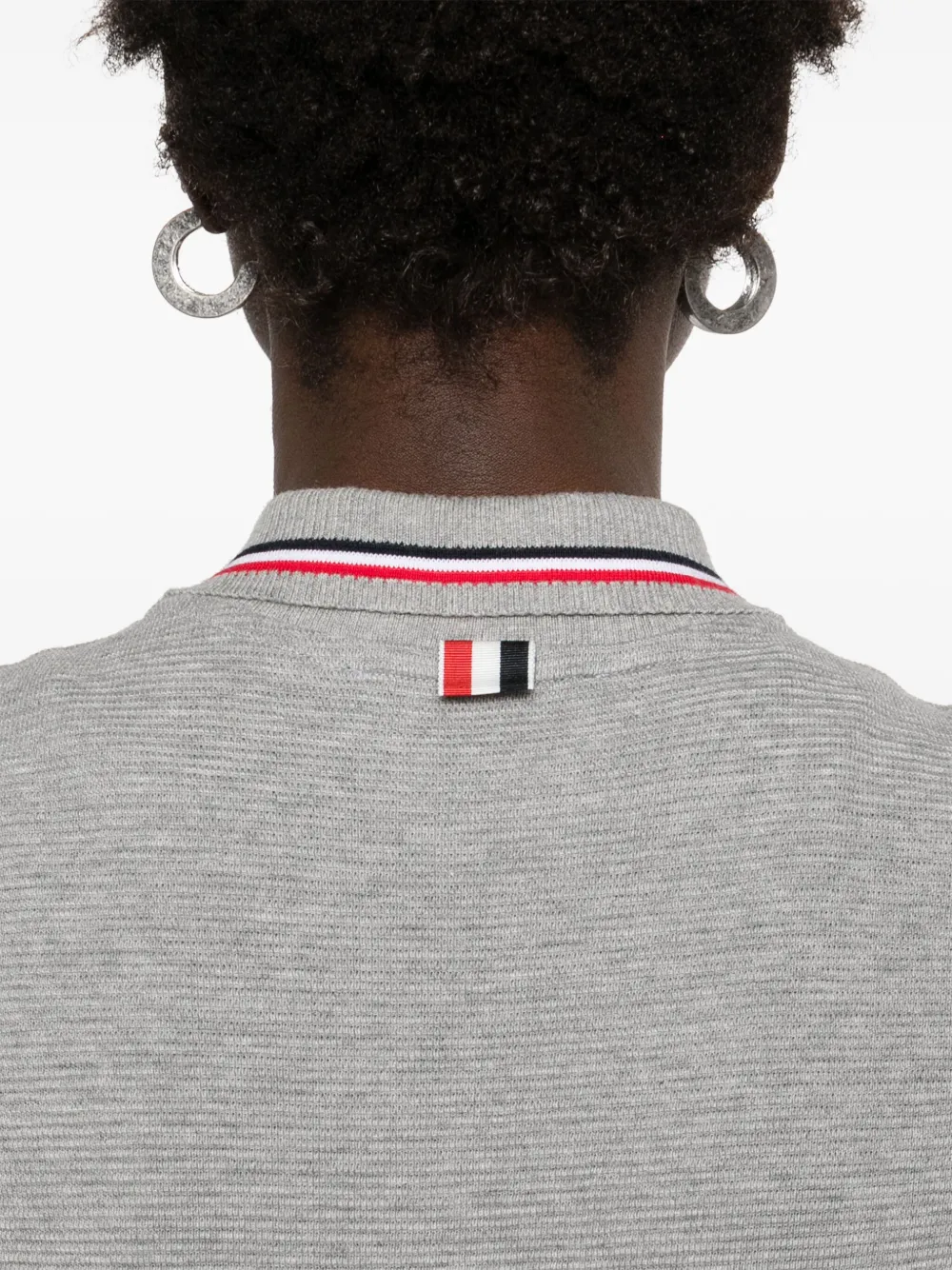 Close up of grey dress, showing texture of the cotton fabric