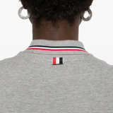 Close up of grey dress, showing texture of the cotton fabric