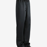 Black pants worn by a person, showing the pants fit