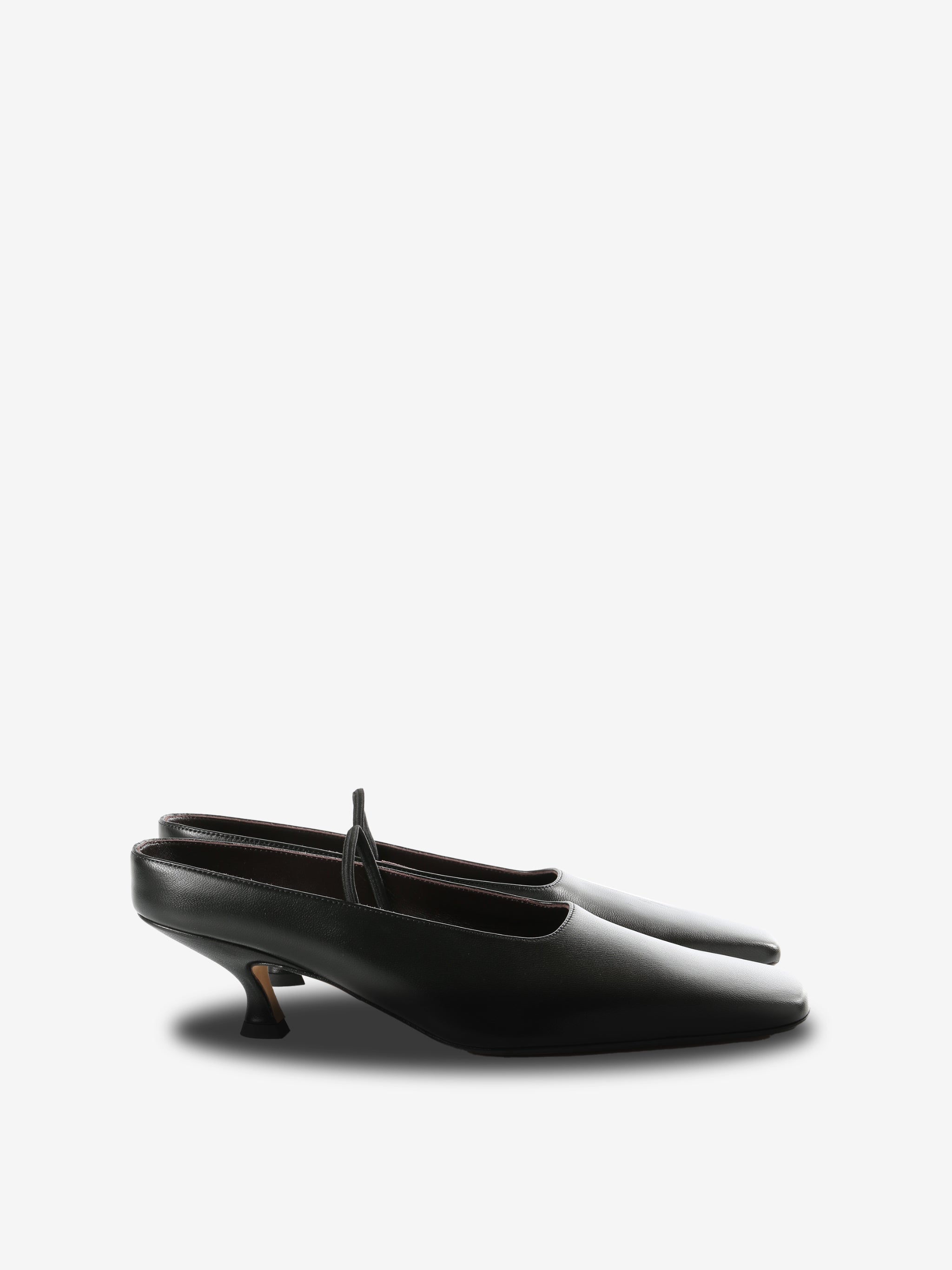 Black mules, front view