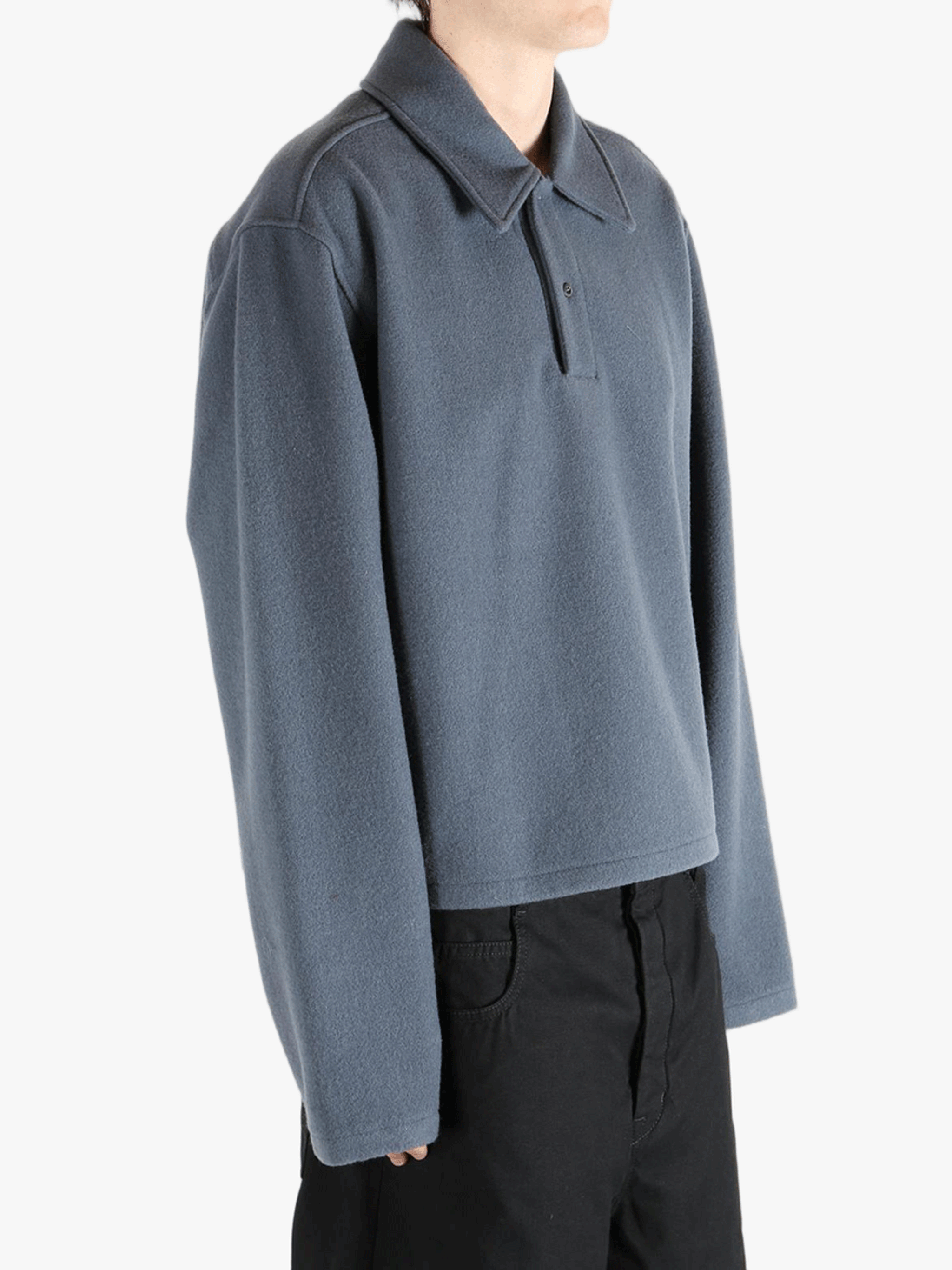 Blue jacket worn by a person, showing the jacket's fit