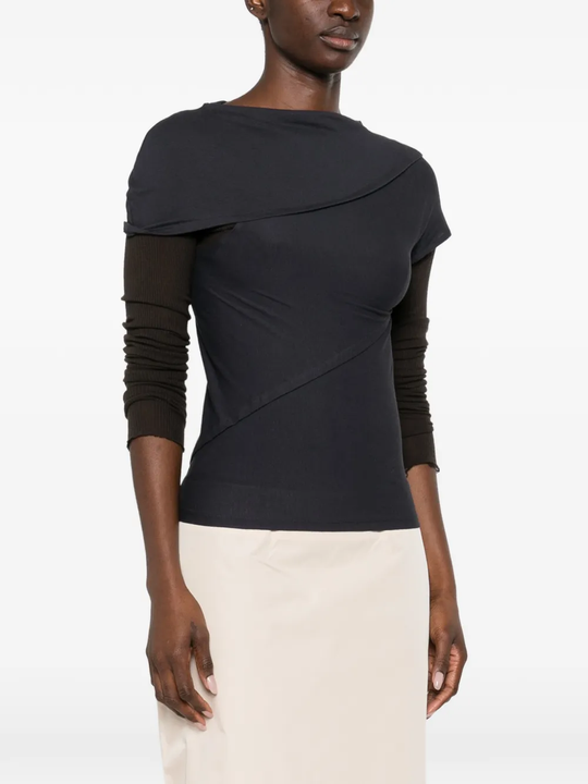 navy t-shirt worn by a person, showing the t-shirt fit