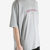 Grey t-shirt worn by a person, showing the t-shirt's fit