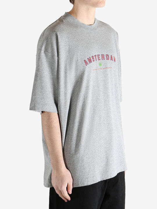 Grey t-shirt worn by a person, showing the t-shirt's fit