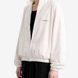 Tan jacket worn by a person, showing the jacket fit