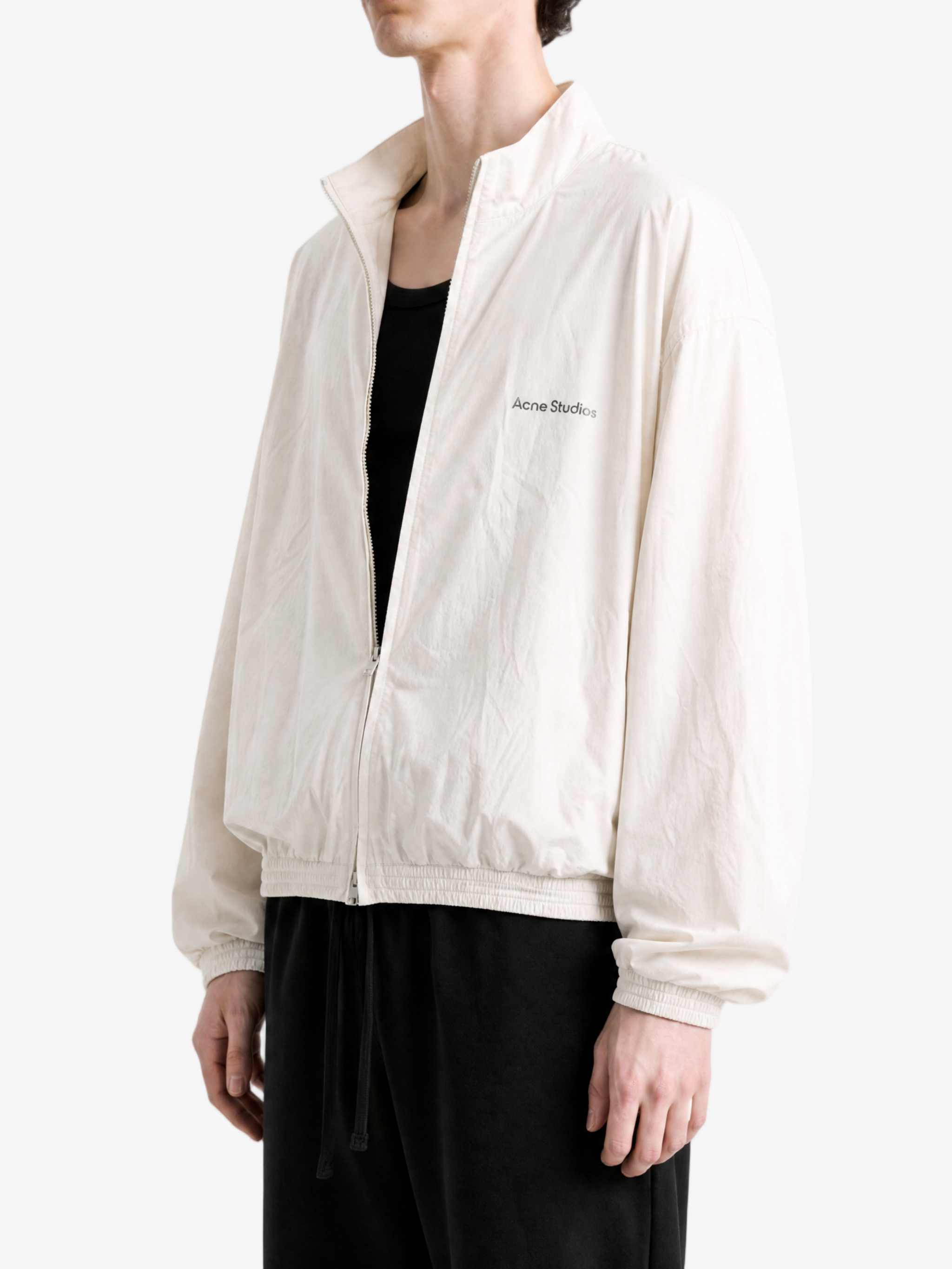Tan jacket worn by a person, showing the jacket fit