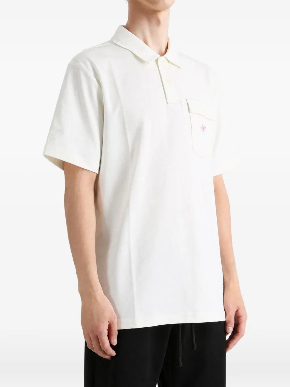 Tan shirt worn by a person, showing the shirt fit