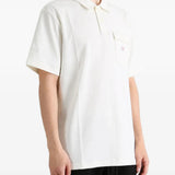 Tan shirt worn by a person, showing the shirt fit