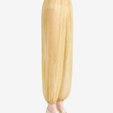 Yellow pants worn by a person, showing the pants fit
