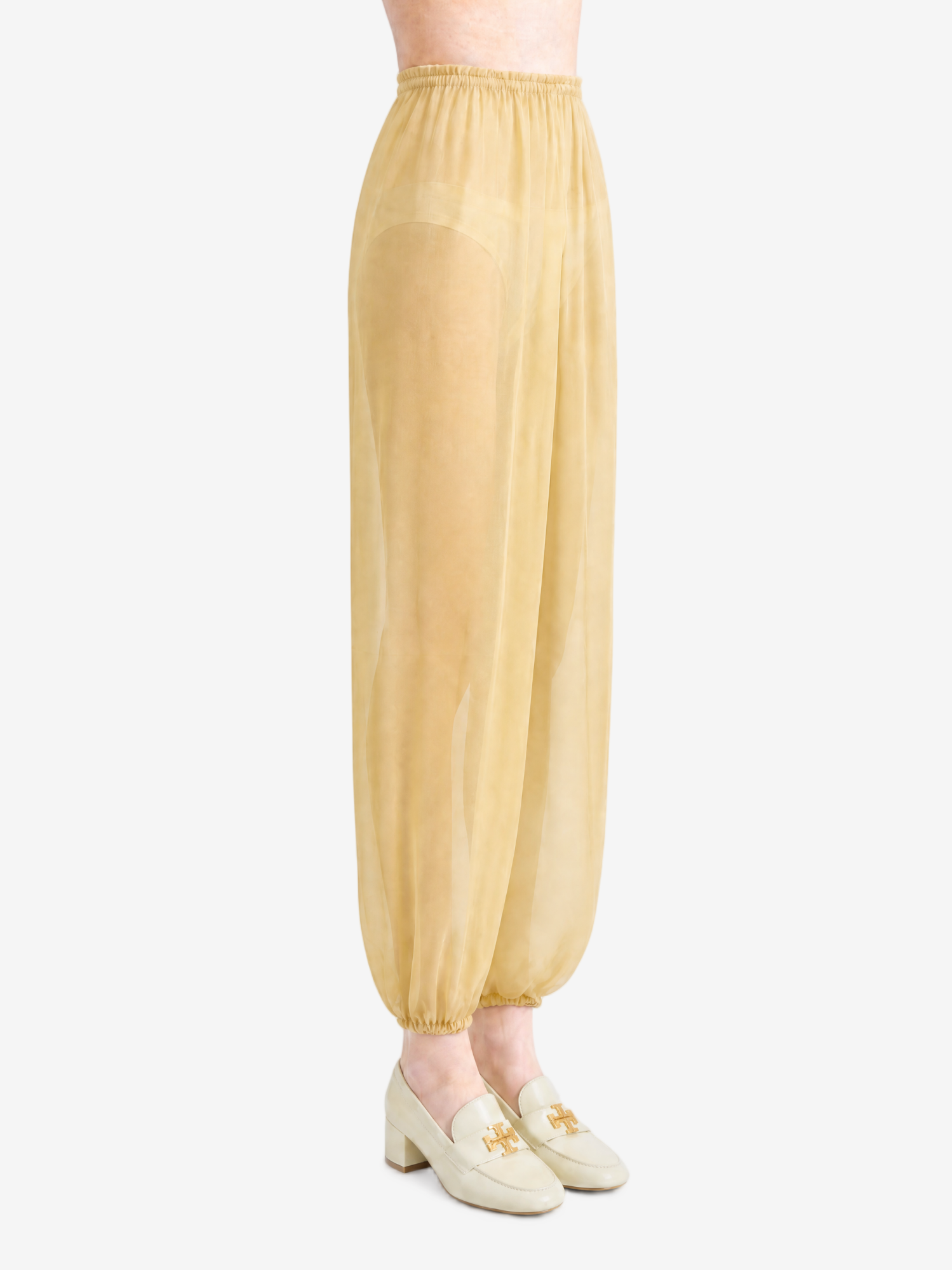 Yellow pants worn by a person, showing the pants fit