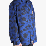 Navy shirt worn by a person, showing the shirt's fit