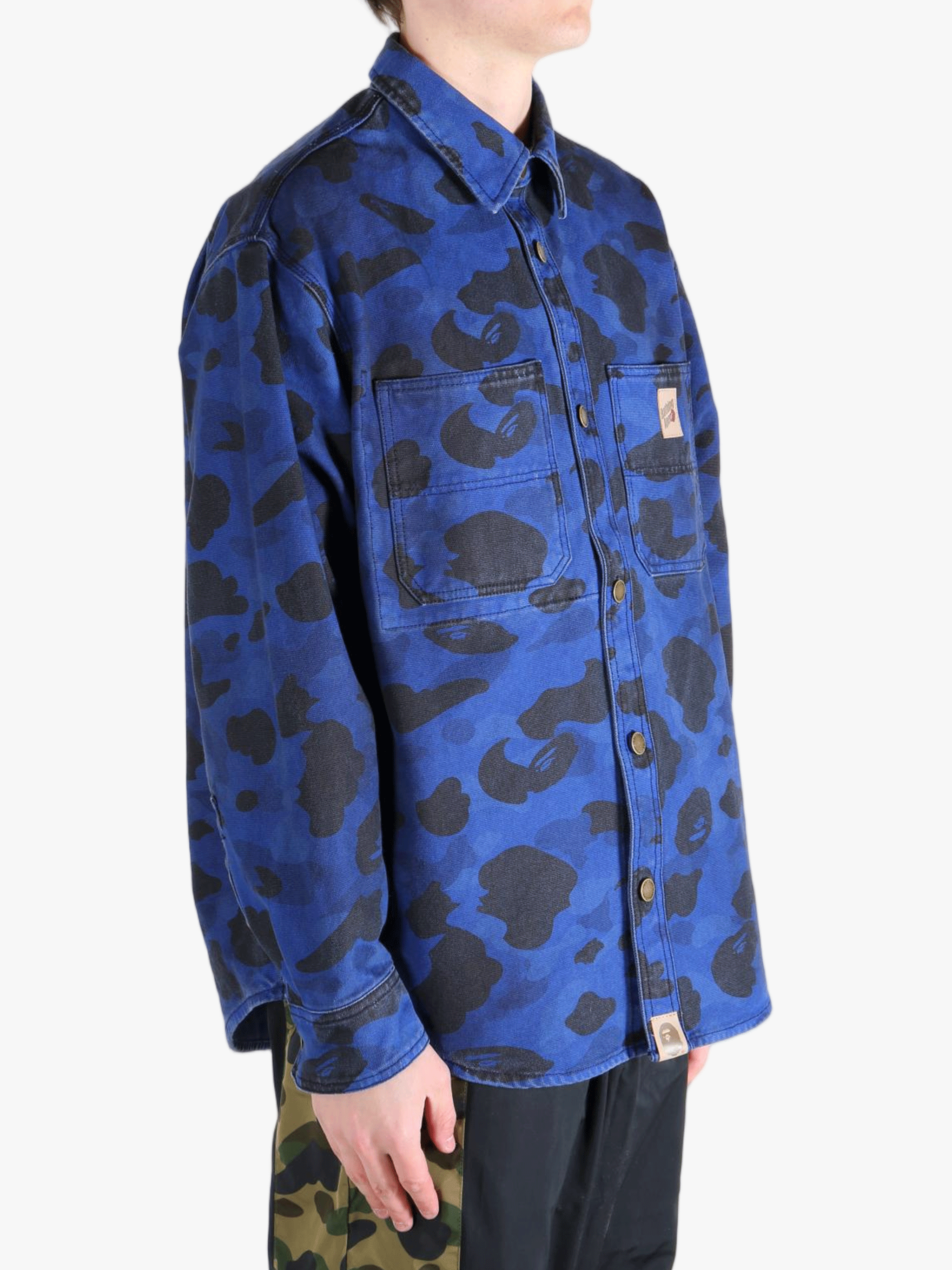 Navy shirt worn by a person, showing the shirt's fit