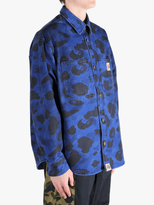 Navy shirt worn by a person, showing the shirt's fit