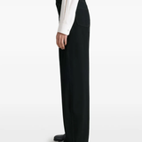 Black pants worn by a person, showing the pants fit