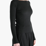 Black knitear worn by a person, showing the knitwear's fit