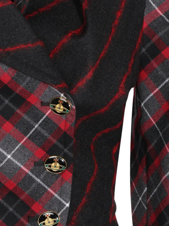 Close up of Black jacket, showing texture of the 98% virgin wool/ 2% elastane made in fabric