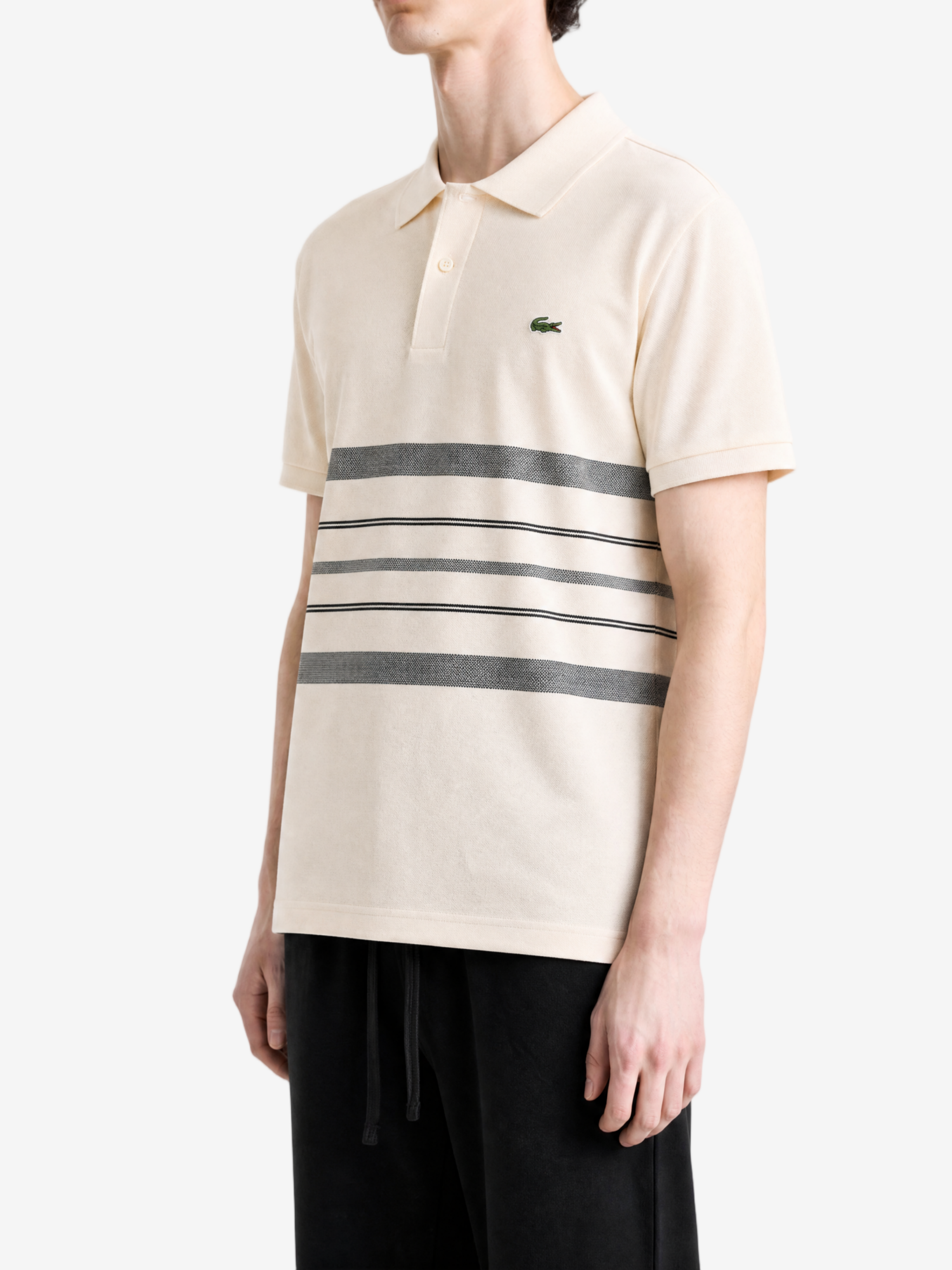 Tan shirt worn by a person, showing the shirt fit