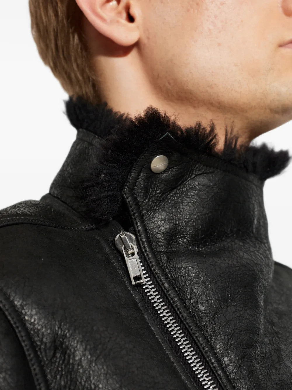 Black jacket worn by a person, showing the jacket fit