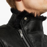 Black jacket worn by a person, showing the jacket fit