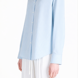 Blue shirt worn by a person, showing the shirt fit