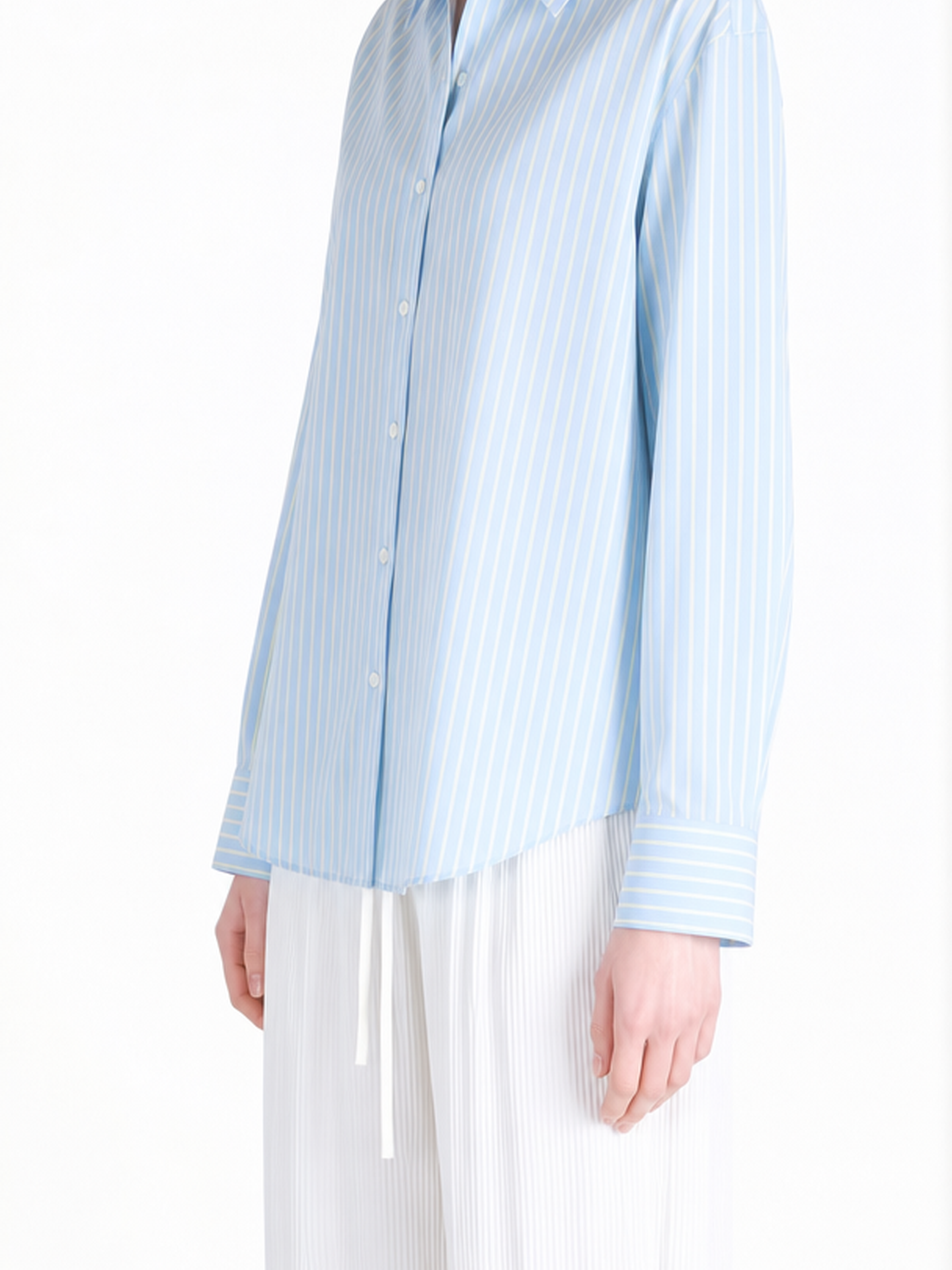 Blue shirt worn by a person, showing the shirt fit