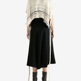 White vests worn by a person, showing the vests fit