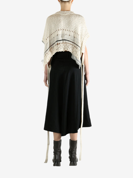 White vests worn by a person, showing the vests fit