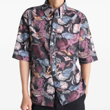 Black shirt worn by a person, showing the shirt's fit