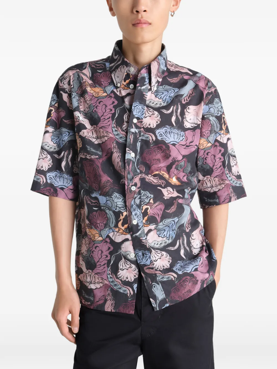 Black shirt worn by a person, showing the shirt's fit