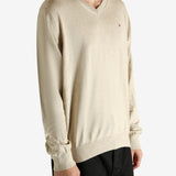 Tan shirt worn by a person, showing the shirt's fit