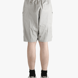 Grey shorts worn by a person, showing the shorts fit