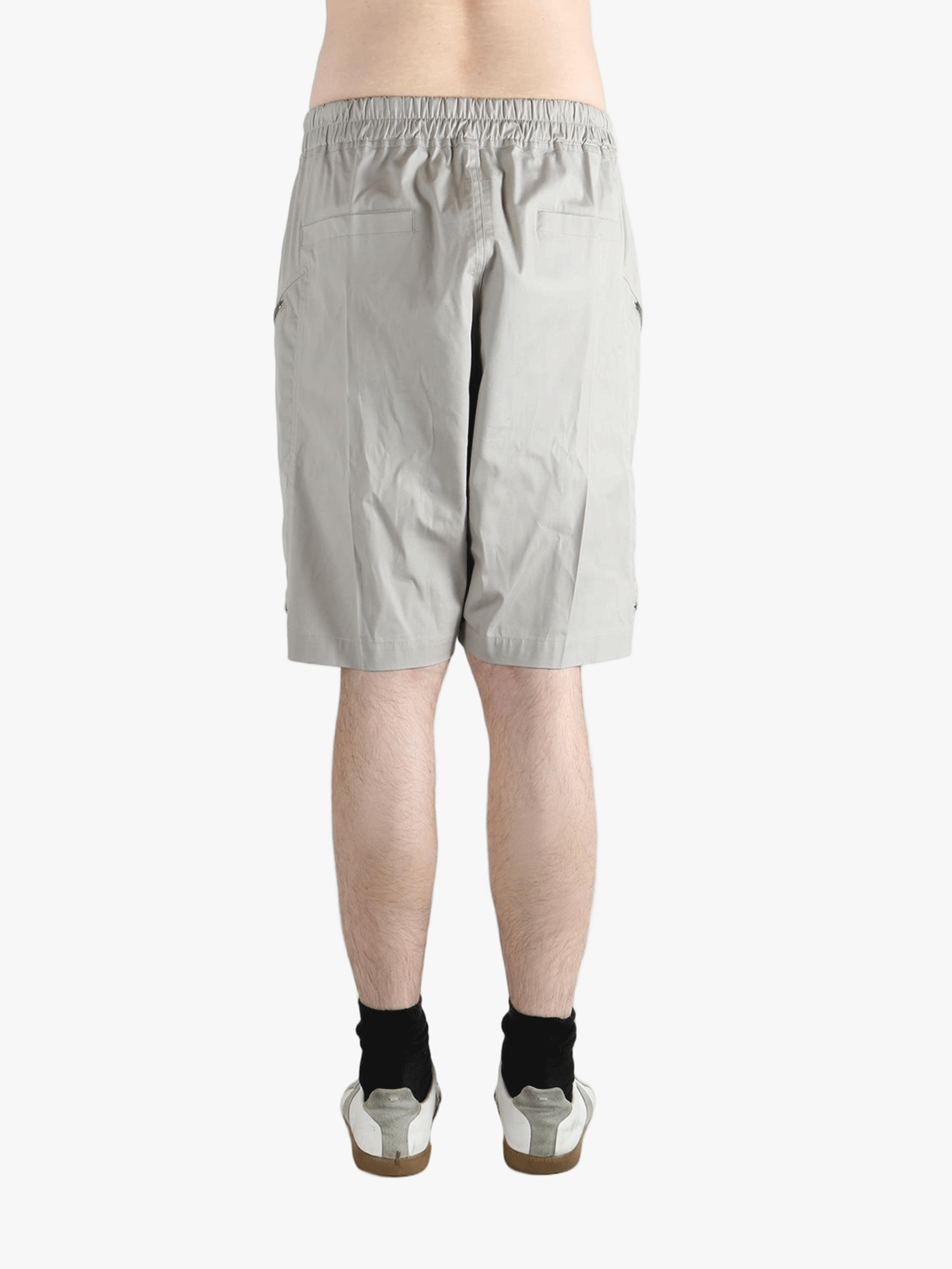 Grey shorts worn by a person, showing the shorts fit