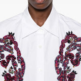 White shirt worn by a person, showing the shirt fit