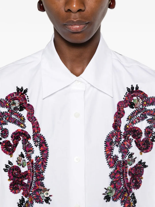 White shirt worn by a person, showing the shirt fit