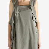 Grey tops worn by a person, showing the tops fit