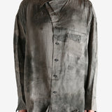 Grey shirt worn by a person, showing the shirt's it